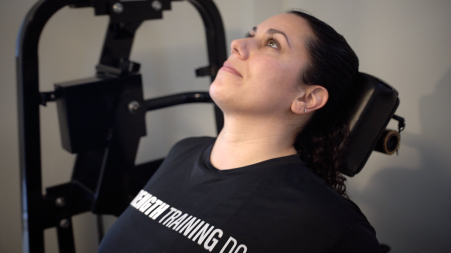 STDC woman on a neck machine