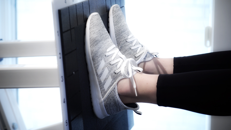 STDC sneakers on a leg machine